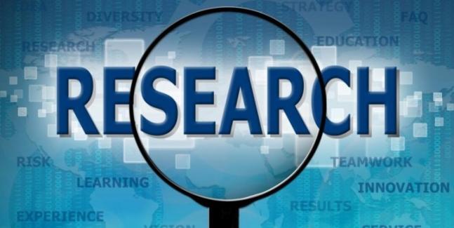 Magnifying glass over the word Research