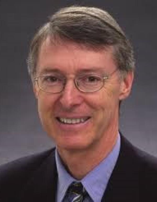 Dr.   Nicholas Delva